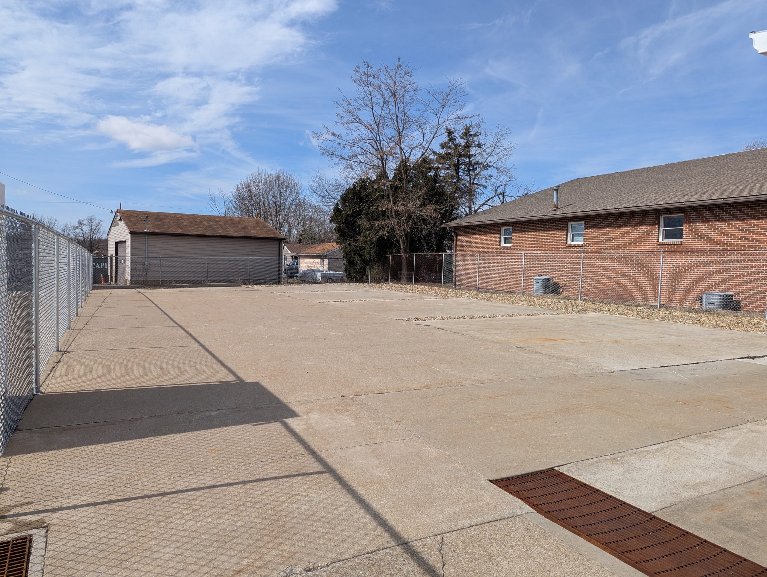 Large, open cement lot for dog training.